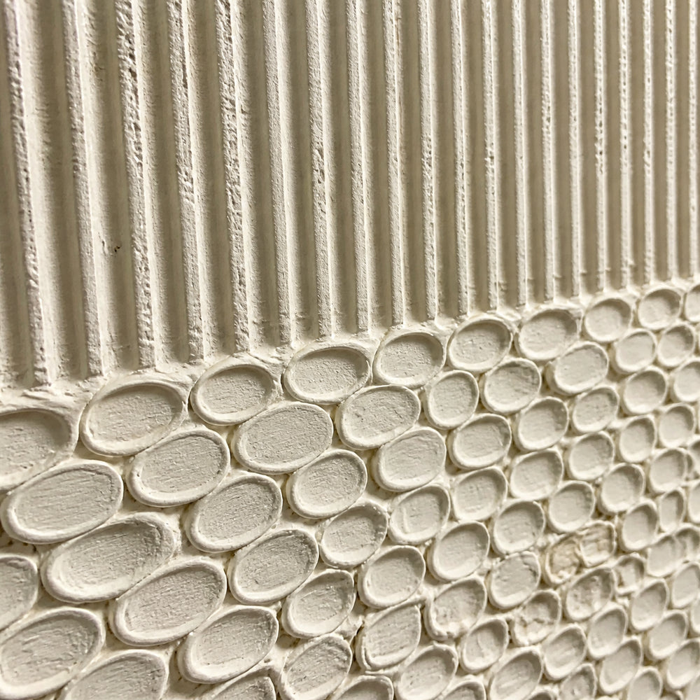 A close view of textured artwork