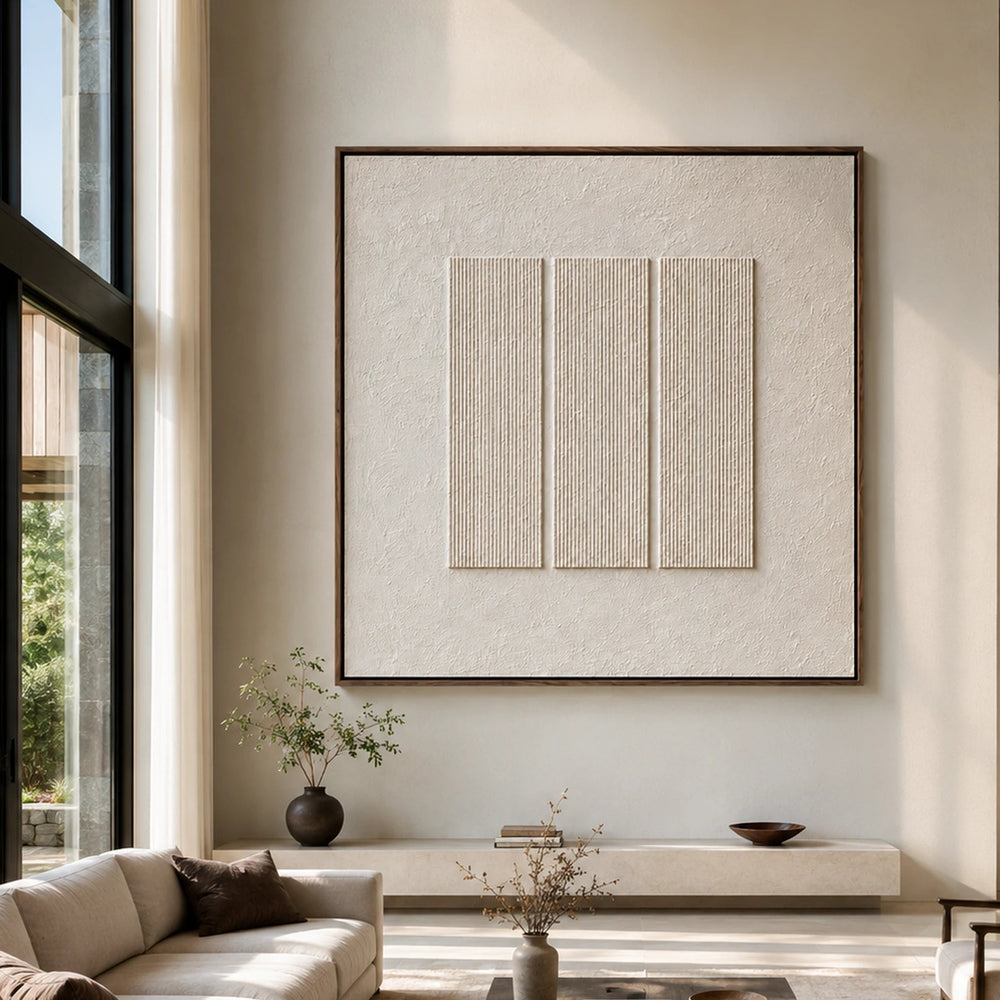 Framed ivory textured artwork in a sunlit neutral interior