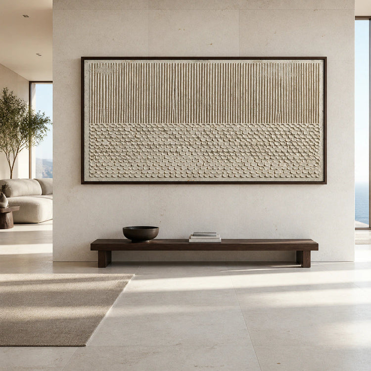Textured artwork above a wooden bench